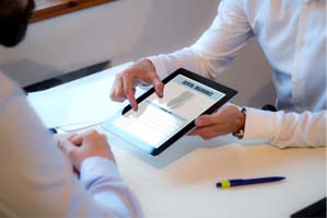 person looking at dental insurance form on a tablet