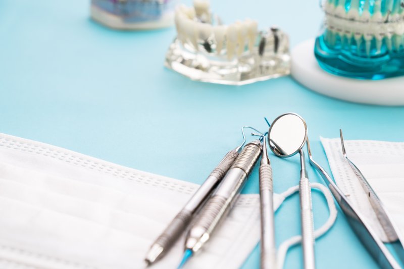 dental tools and mask on table