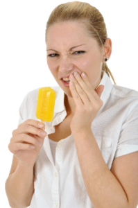 Woman experiencing tooth sensitivity